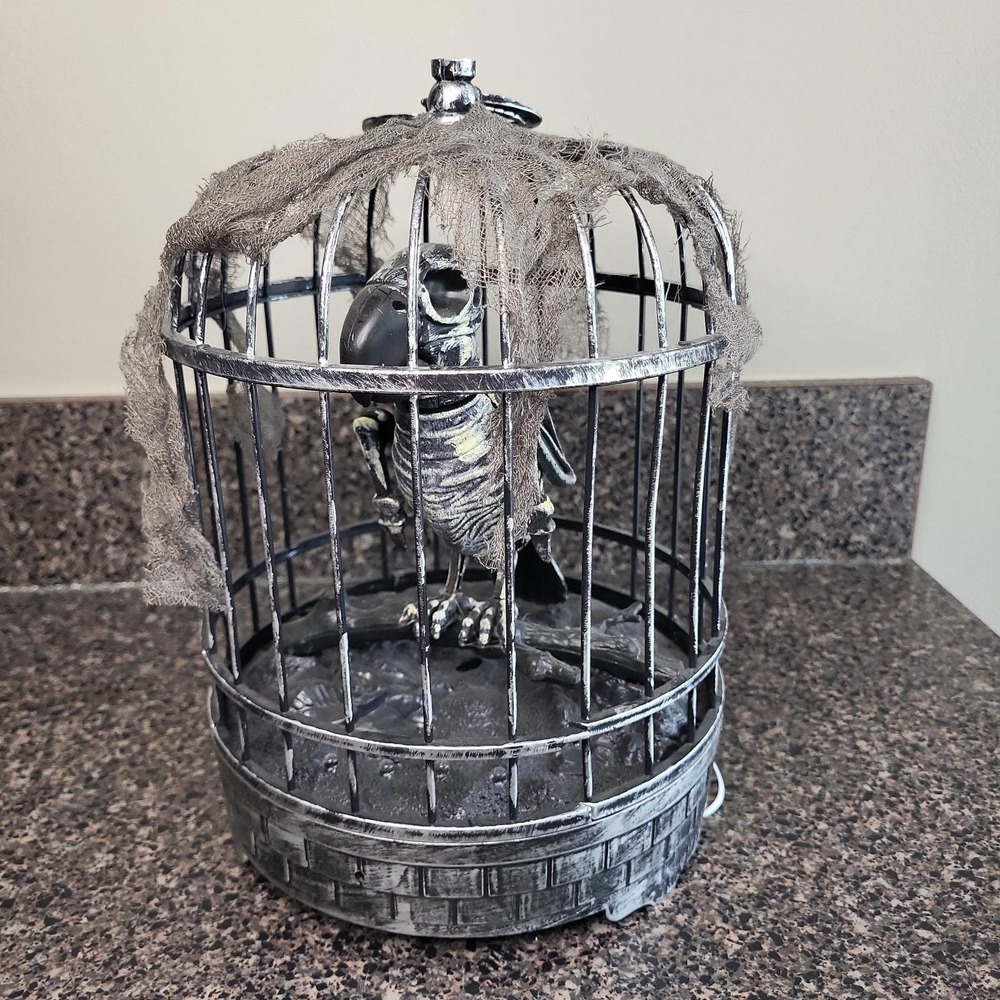 Spooky Village Animated Talking Skeleton Zombie‎ Parrot in Cage Halloween Motion